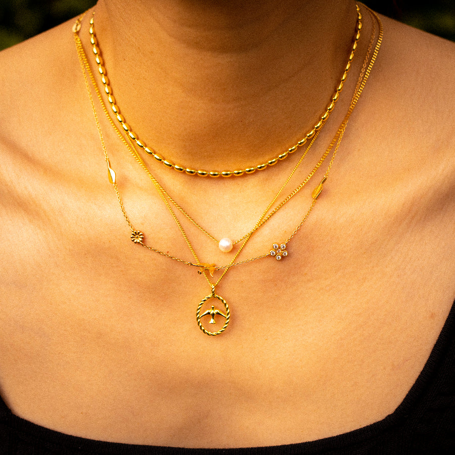 'Maureen' gold curb chain with 925 sterling silver bird charm