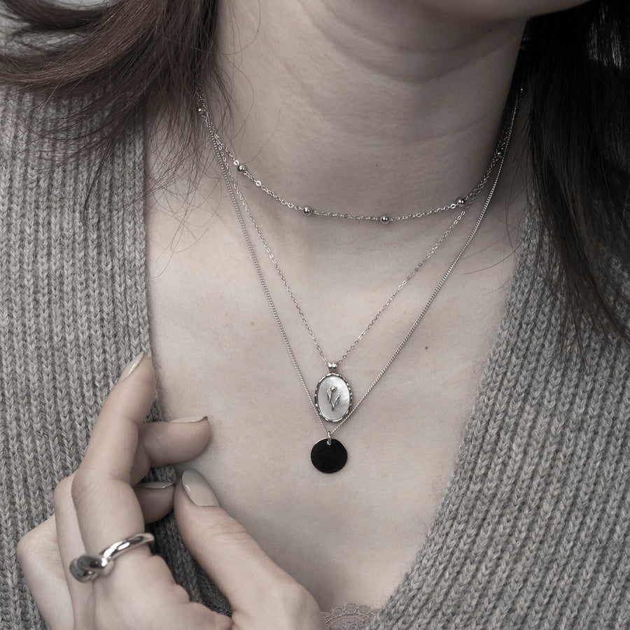 'Bulwer' silver necklace made of 925 sterling silver with an oval mother-of-pearl tulip pendant