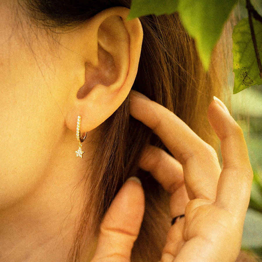 'Ocune' gold faceted hoop earrings with star pendant made from 925 sterling silver