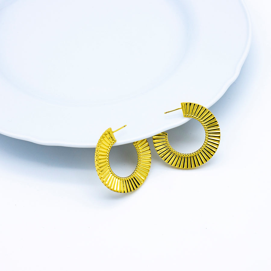 'Kasese' gold large hoop earrings Hoops Huggies made of brass